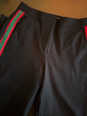 Boden Black Garment with Red and Green Trim. Wide leg with zip ankle detail.